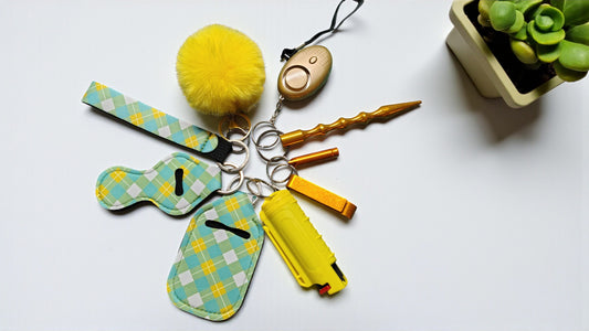 DISCONTINUED DESIGNS = 9 Piece Keychain Kit Novelty Collection with Pepper Spray